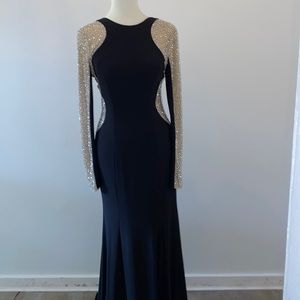 Figure flattering! Elegant formal dress.  Black with sheer sides/arms beaded.